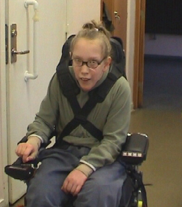 Mia in a wheelchair
