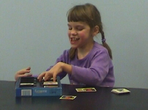 Mikaela is playing with cards