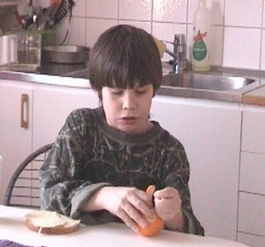 Niklas peeling an orange
